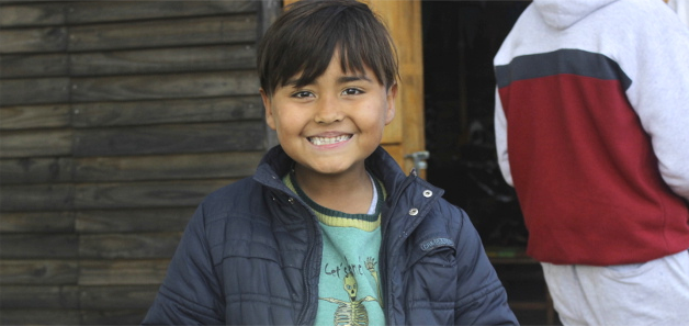 a smiling child looking at the camera