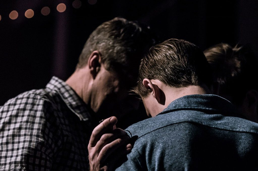 two people praying together